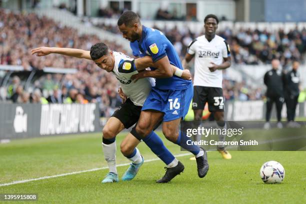 Luke Plange of Derby County is challenged by Curtis Nelson of Cardiff City during the Sky Bet Championship match between Derby County and Cardiff...