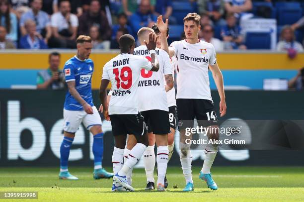 Patrik Schick celebrates with Moussa Diaby of Bayer 04 Leverkusen after scoring their team's first goal during the Bundesliga match between TSG...