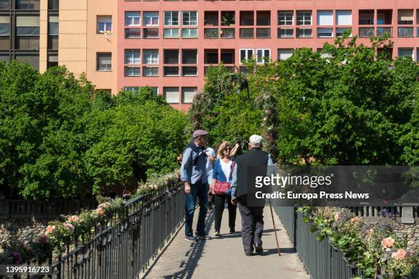 Numerous people at the 'Temps de Flors 2022' festival, on a bridge in the historic center of the city, on May 7 in Girona, Catalonia, Spain. Girona...
