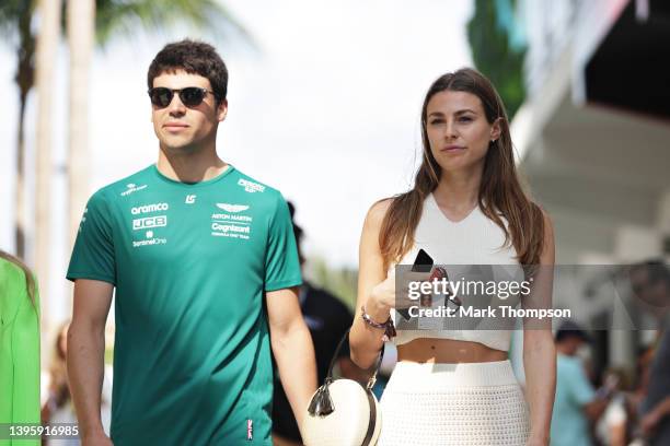 Lance Stroll of Canada and Aston Martin F1 Team walks in the Paddock with his girlfriend Sara Pagliaroli prior to final practice ahead of the F1...