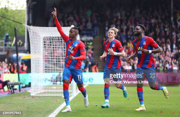 Wilfried Zaha of Crystal Palace celebrates after scoring their team's first goal from the penalty spot during the Premier League match between...