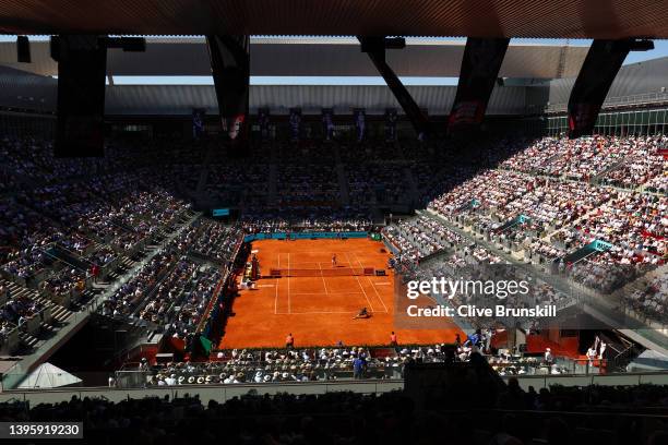 General view of the venue as Carlos Alcaraz of Spain stretches for a forehand in their Men's Singles semi-finals match against Novak Djokovic of...