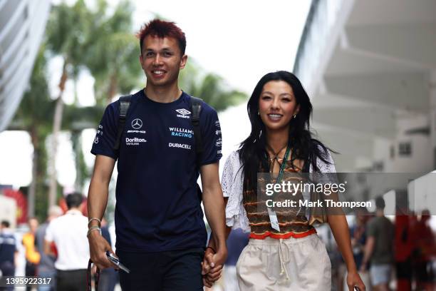 Alexander Albon of Thailand and Williams walks in the Paddock with his girlfriend, golfer Lily Muni prior to final practice ahead of the F1 Grand...