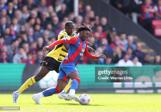 Eberechi Eze of Crystal Palace is challenged by Moussa Sissoko of Watford FC during the Premier League match between Crystal Palace and Watford at...