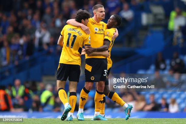 Francisco Trincao celebrates with Leander Dendoncker and Chiquinho of Wolverhampton Wanderers after scoring their team's first goal during the...
