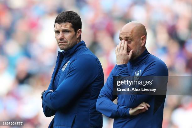 Michael Jackson, Caretaker Manager of Burnley and Paul Jenkins, Academy Director of Burnley react during the Premier League match between Burnley and...