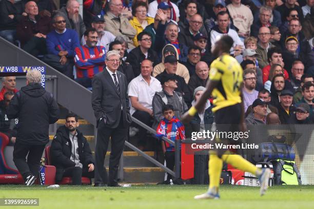 Roy Hodgson looks on as Hassane Kamara of Watford FC leaves the pitch after being red carded for a foul during the Premier League match between...