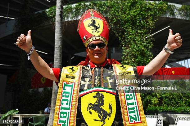 Ferrari fan dressed as a bishop poses for a photo in the Paddock prior to final practice ahead of the F1 Grand Prix of Miami at the Miami...