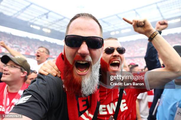 Koeln fans celebrate after their sides qualification for European football during the Bundesliga match between 1. FC Köln and VfL Wolfsburg at...