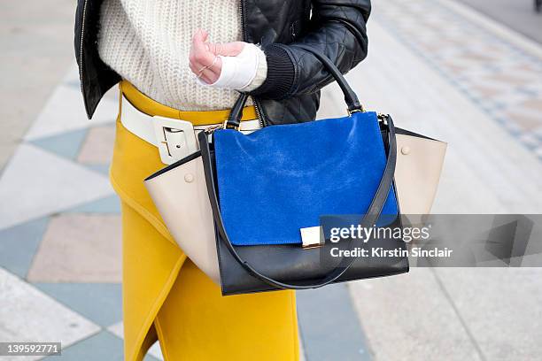 Blogger Hedvig Opshaug wearing Celine bag, YSL belt, Proenza Schouler skirt , Acne Jumper, Topshop boutique jacket street style at London fashion...