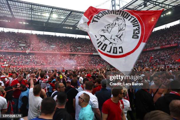 Koeln fans celebrate after their sides qualification for European football during the Bundesliga match between 1. FC Köln and VfL Wolfsburg at...