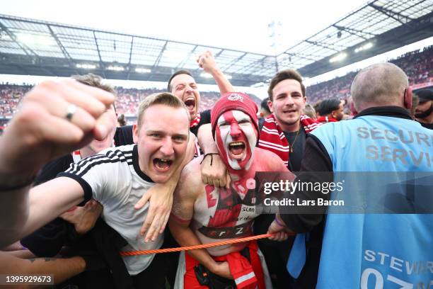 Koeln fans celebrate after their sides qualification for European football during the Bundesliga match between 1. FC Köln and VfL Wolfsburg at...