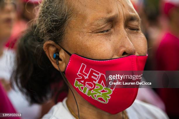 Leni Robredo supporter crys during a campaign rally on May 07, 2022 in Manila, Philippines. Candidates for the May 9 presidential elections held...