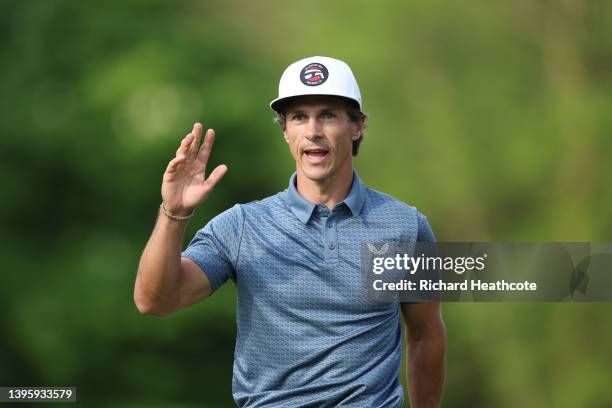 Thorbjorn Olesen of Denmark reacts as he holes a birdie putt on the 18th green during Day Three of the Betfred British Masters hosted by Danny...