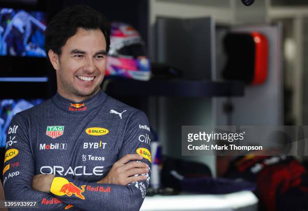 Sergio Perez of Mexico and Oracle Red Bull Racing looks on in the garage during final practice ahead of the F1 Grand Prix of Miami at the Miami...