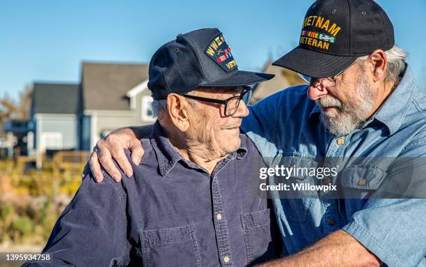 usa military war veteran two generation family senior men - war veteran stock pictures, royalty-free photos & images