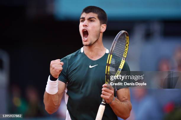 Carlos Alcaraz of Spain celebrates in their Men's Singles semi-finals match against Novak Djokovic of Serbia during day ten of Mutua Madrid Open at...