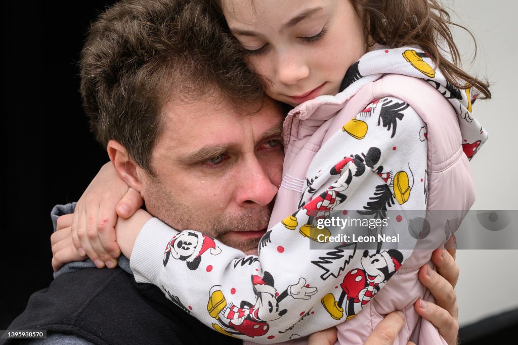 Yevchenko Eugene Yevchenko cries as he bids farewell to his daughter Maria at a ...
