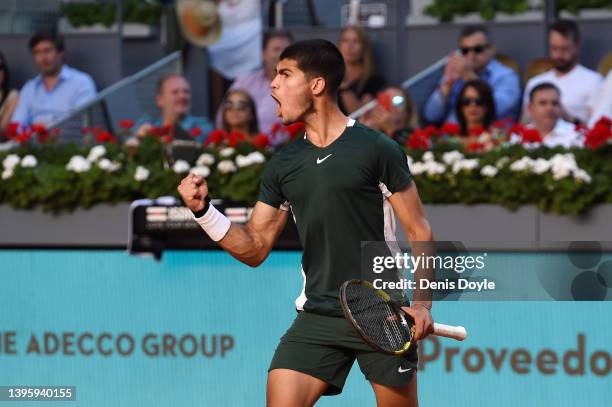 Carlos Alcaraz of Spain celebrates in their Men's Singles semi-finals match against Novak Djokovic of Serbia during day ten of Mutua Madrid Open at...