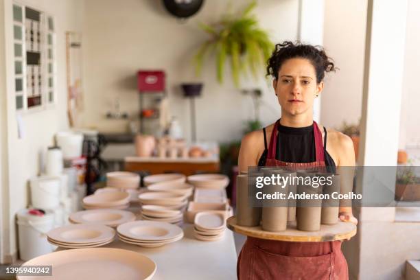 ceramist holding ceramic pieces in raw clay - pottery making stock pictures, royalty-free photos & images