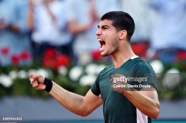 Carlos Alcaraz of Spain celebrates after winning match point in their Men's Singles semi-finals match against Novak Djokovic of Serbia during day ten...