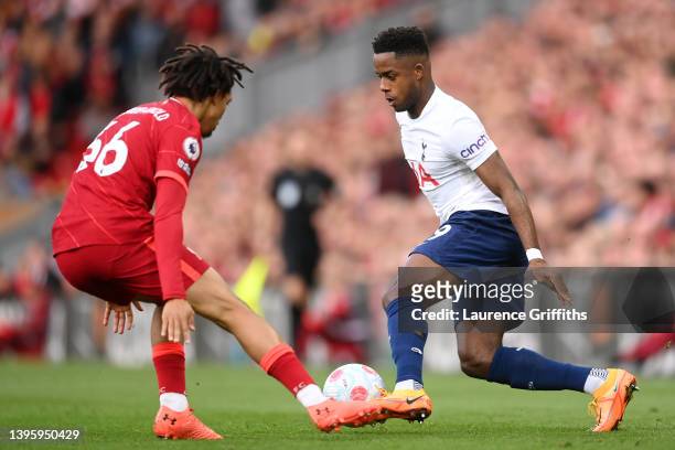 Ryan Sessegnon of Tottenham Hotspur runs with the ball under pressure from Trent Alexander-Arnold of Liverpool during the Premier League match...