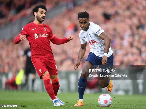 Ryan Sessegnon of Tottenham Hotspur runs with the ball under pressure from Mohamed Salah of Liverpool during the Premier League match between...