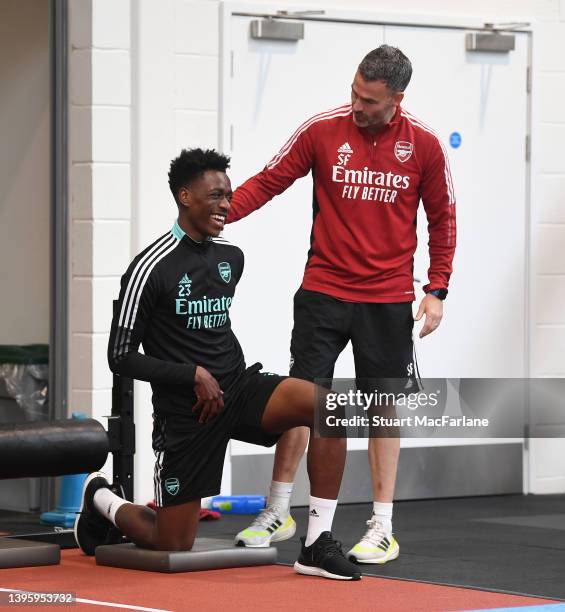 Arsenal Head of Performance Shad Forsythe with Sambi during a training session at London Colney on May 07, 2022 in London, England.