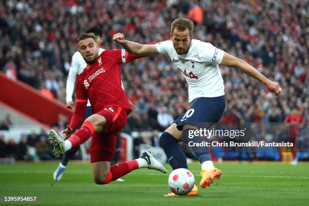 Jordan Henderson of Liverpool challenges Harry Kane of Tottenham Hotspur during the Premier League match between Liverpool and Tottenham Hotspur at...