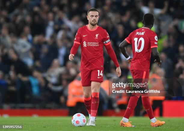 Jordan Henderson of Liverpool looks dejected after conceding their first goal during the Premier League match between Liverpool and Tottenham Hotspur...