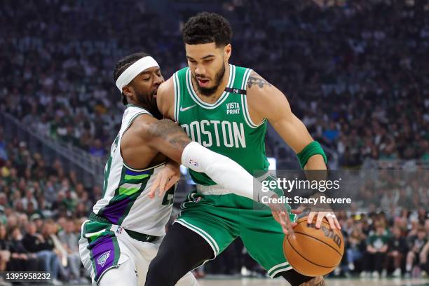 Jayson Tatum of the Boston Celtics is defended by Wesley Matthews of the Milwaukee Bucks during the first quarter of Game Three of the Eastern...