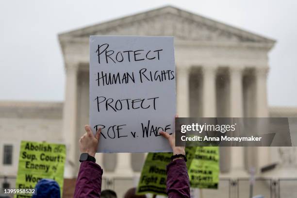 An abortion-rights protester holds up a sign during a demonstration in front of the U.S. Supreme Court Building on May 07, 2022 in Washington, DC....