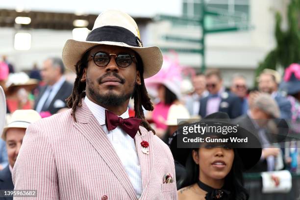 Player Cam Newton watches an undercard race before the running of the 148th Kentucky Derby at Churchill Downs on May 07, 2022 in Louisville, Kentucky.