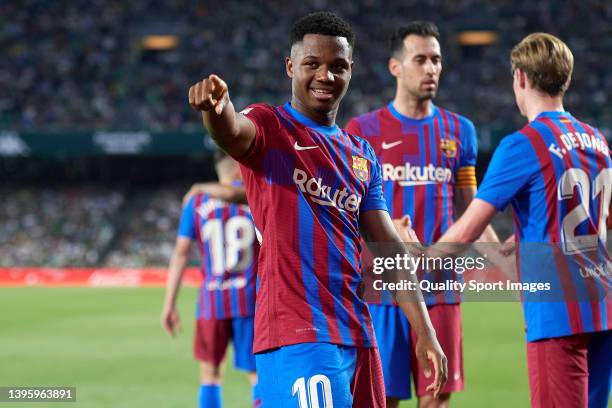 Ansu Fati of FC Barcelona celebrates after scoring his team's first goal during the La Liga Santander match between Real Betis and FC Barcelona at...