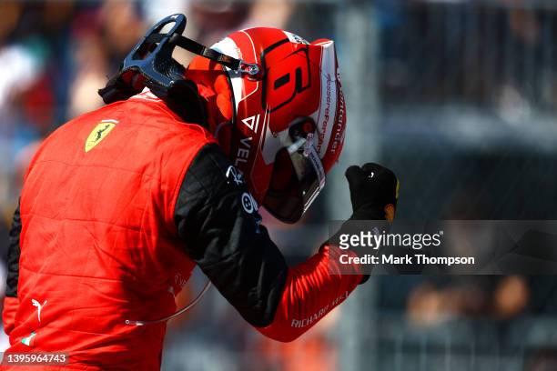 Pole position qualifier Charles Leclerc of Monaco and Ferrari celebrates in parc ferme during qualifying ahead of the F1 Grand Prix of Miami at the...