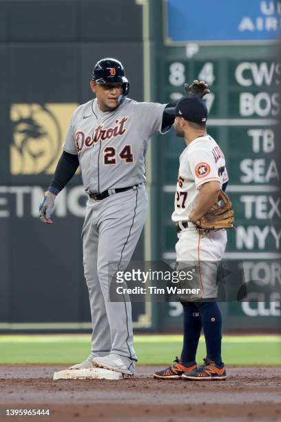 Miguel Cabrera of the Detroit Tigers is congratulated by Jose Altuve of the Houston Astros after a record setting double in the third inning at...