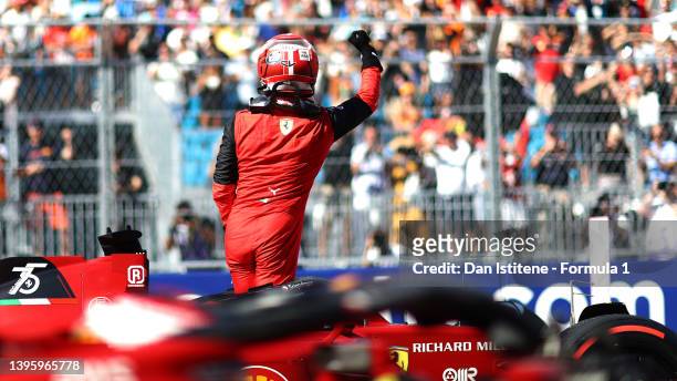 Pole position qualifier Charles Leclerc of Monaco and Ferrari celebrates in parc ferme during qualifying ahead of the F1 Grand Prix of Miami at the...