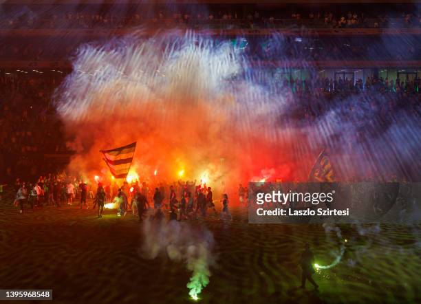 Supporters of Ferencvarosi TC celebrate the 33rd Hungarian championship title and light torches after the Hungarian OTP Bank Liga match between...