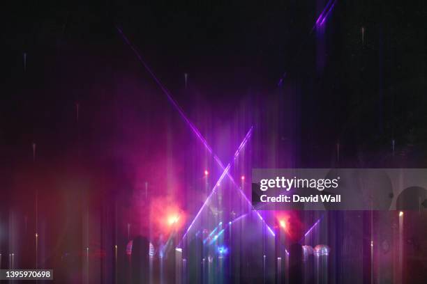 a neon abstract concept. of a party at a music festival. with lasers and lights. with a blurred dream like edit - bash 2015 concert imagens e fotografias de stock