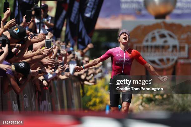 Daniela Ryf of Switzerland celebrates as she crosses the finish line to win the 2021 IRONMAN World Championships on May 07, 2022 in St George, Utah.