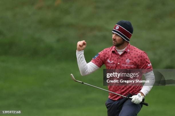 Denny McCarthy of the United States celebrates after chipping in on the 18th hole during the third round of the Wells Fargo Championship at TPC...