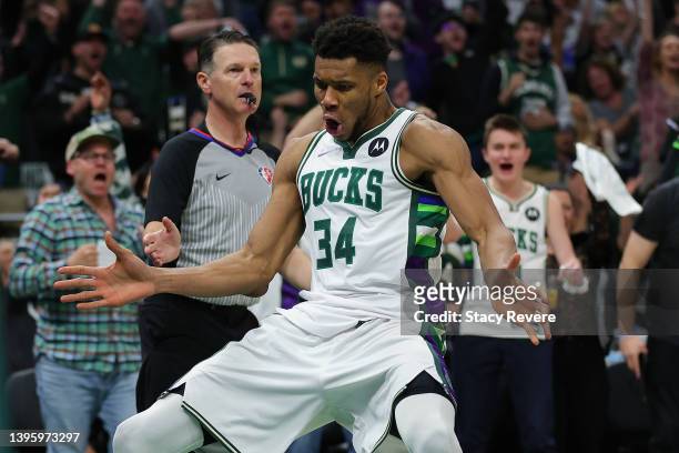 Giannis Antetokounmpo of the Milwaukee Bucks reacts to a score during the second half of Game Three of the Eastern Conference Semifinals against the...