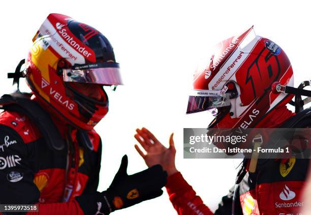 Pole position qualifier Charles Leclerc of Monaco and Ferrari and Second placed qualifier Carlos Sainz of Spain and Ferrari celebrate in parc ferme...