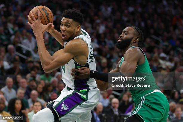 Giannis Antetokounmpo of the Milwaukee Bucks is defended by Jaylen Brown of the Boston Celtics during the second half of Game Three of the Eastern...