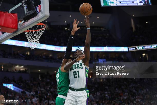 Jrue Holiday of the Milwaukee Bucks shoots over Al Horford of the Boston Celtics during the second half of Game Three of the Eastern Conference...