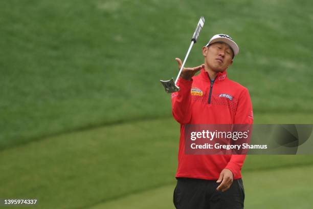 James Hahn of the United States reacts after making a bogey on the 18th hole during the third round of the Wells Fargo Championship at TPC Potomac...