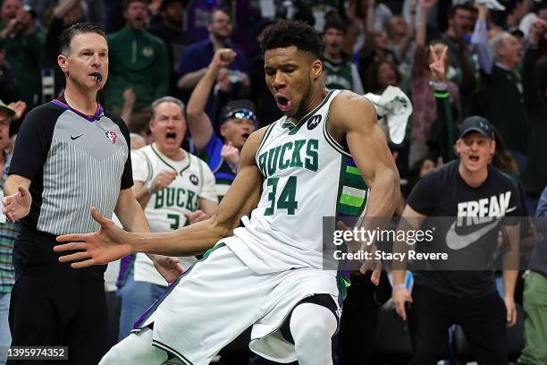 Giannis Antetokounmpo of the Milwaukee Bucks reacts to a score during the second half of Game Three of the Eastern Conference Semifinals against the...