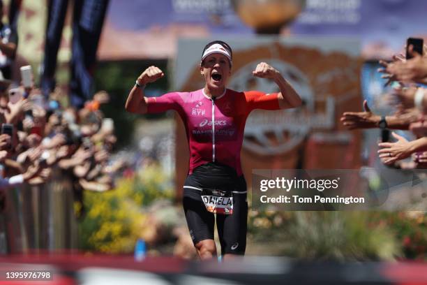 Daniela Ryf of Switzerland celebrates as nears the finish line to win the 2021 IRONMAN World Championships on May 07, 2022 in St George, Utah.