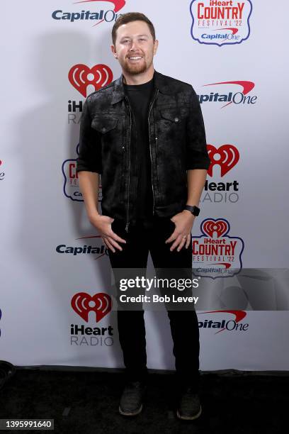 Scotty McCreery poses backstage during the 2022 iHeartCountry Festival presented by Capital One at the new state-of-the-art venue Moody Center on May...