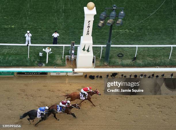 Rich Strike with Sonny Leon up crosses the finish line to win ahead of Epicenter and Zandon during the 148th running of the Kentucky Derby at...